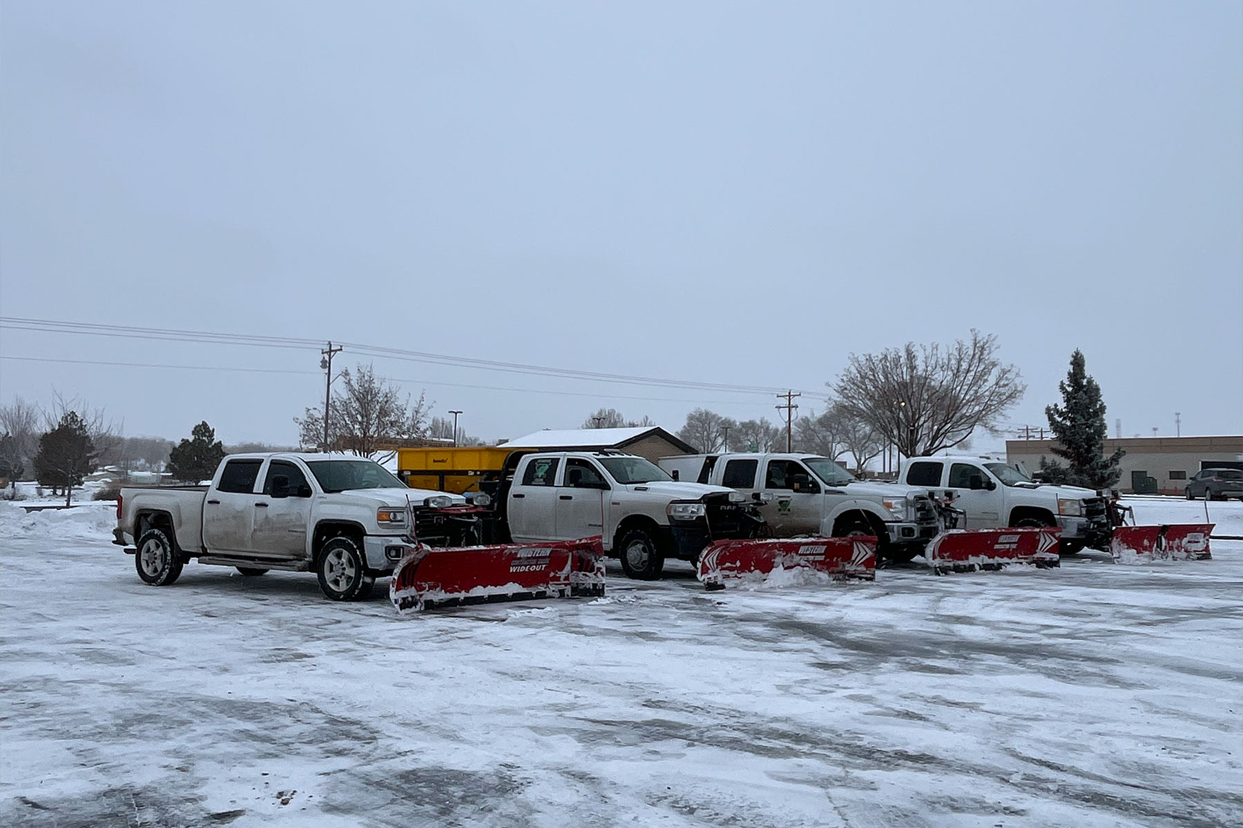 Snow removal trucks with  snow plows